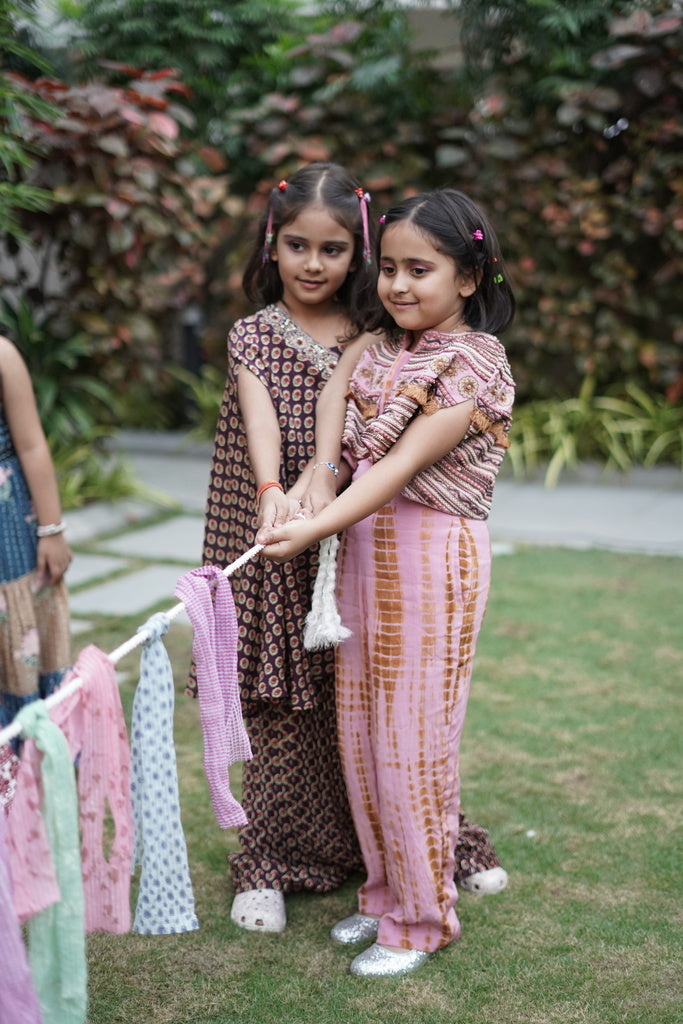 Pink and brown shibori jumpsuit with embroidered cape