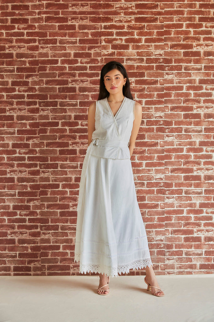 White cotton overlapping sleeveless top with belt