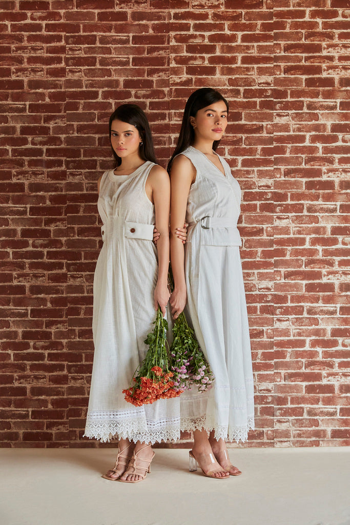 White cotton overlapping sleeveless top with belt