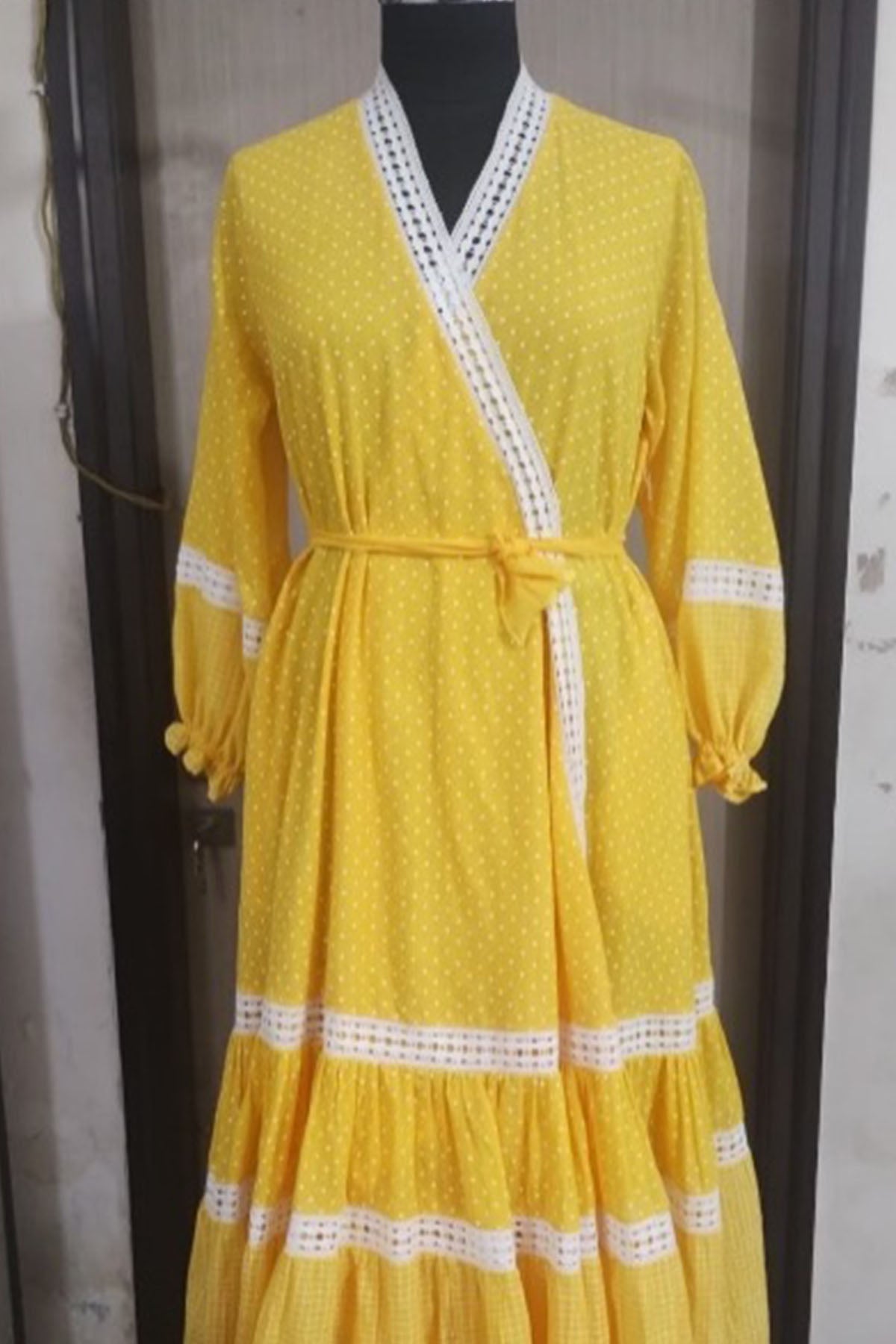 Yellow cotton polka dot printed tiered wrap around dress with lace details