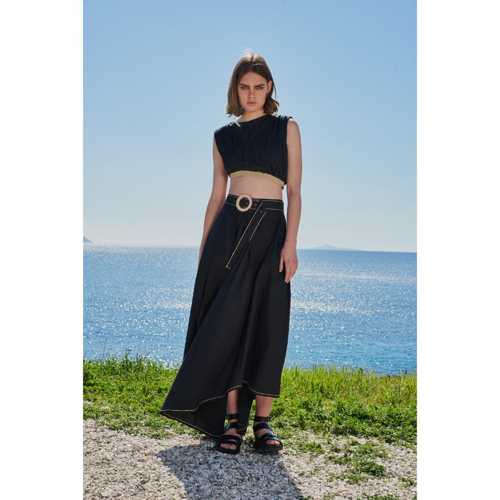 Trishala Sikka in Black poplin asymetrical skirt with chawal taka hemline and belt paired with ruched crop top