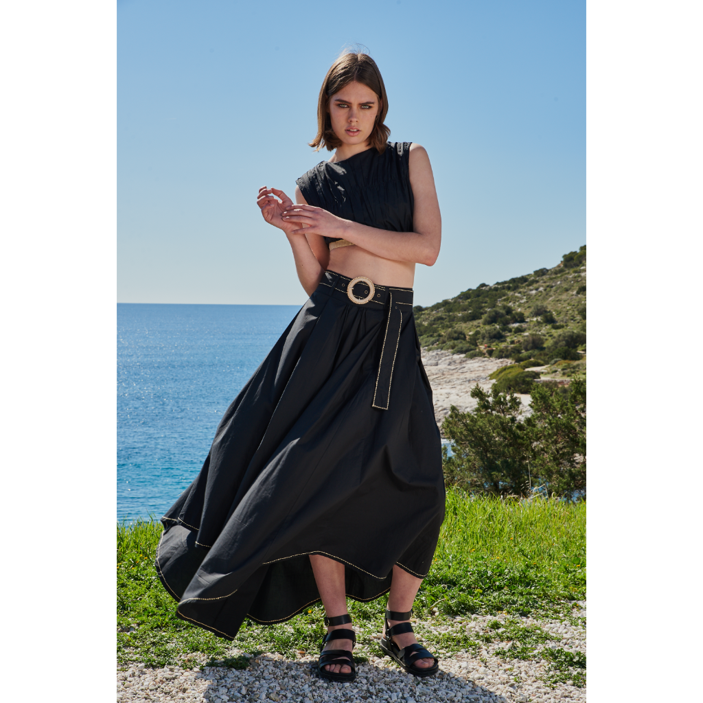 Trishala Sikka in Black poplin asymetrical skirt with chawal taka hemline and belt paired with ruched crop top