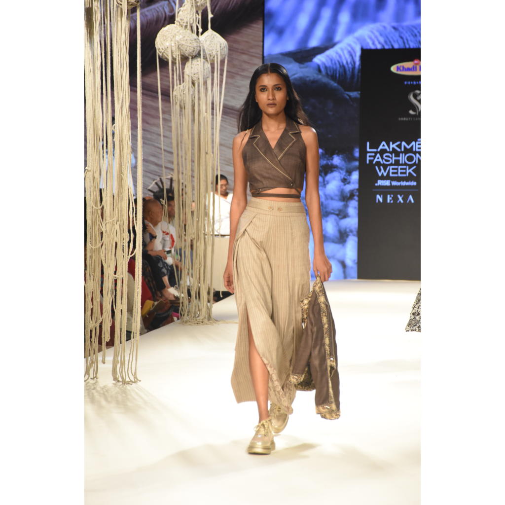 Brown khadi tie up crop top with beige stripe slit and pleated pants and brown embroidered crop jacket