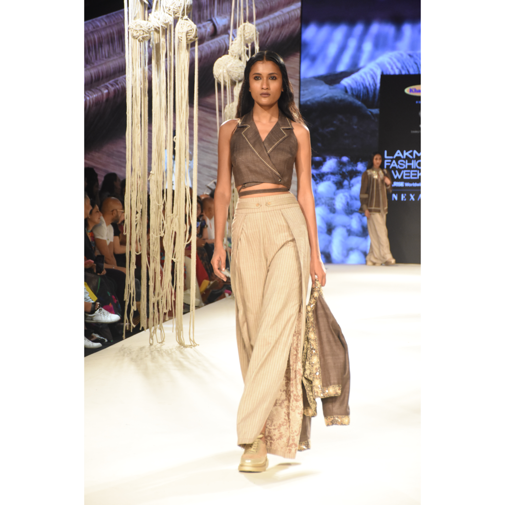 Brown khadi tie up crop top with beige stripe slit and pleated pants and brown embroidered crop jacket