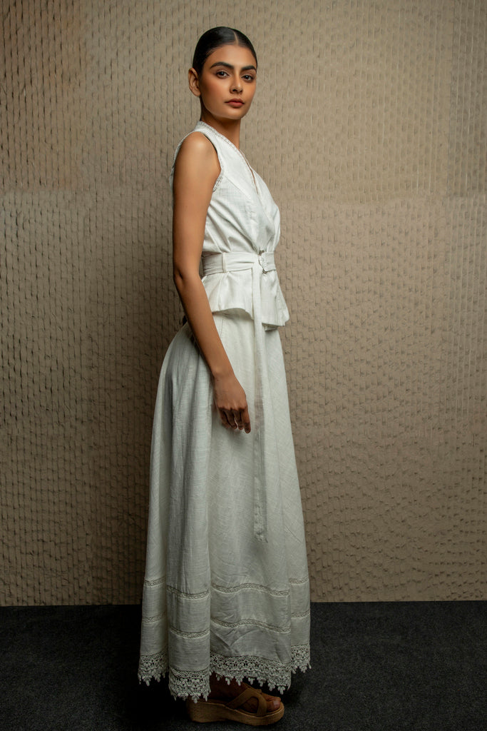 White cotton overlapping sleeveless top with belt