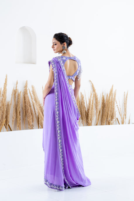 Lilac pearl crepe draped saree with embroidered border, blouse and waist belt