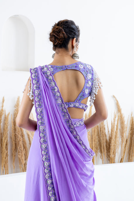 Lilac pearl crepe draped saree with embroidered border, blouse and waist belt
