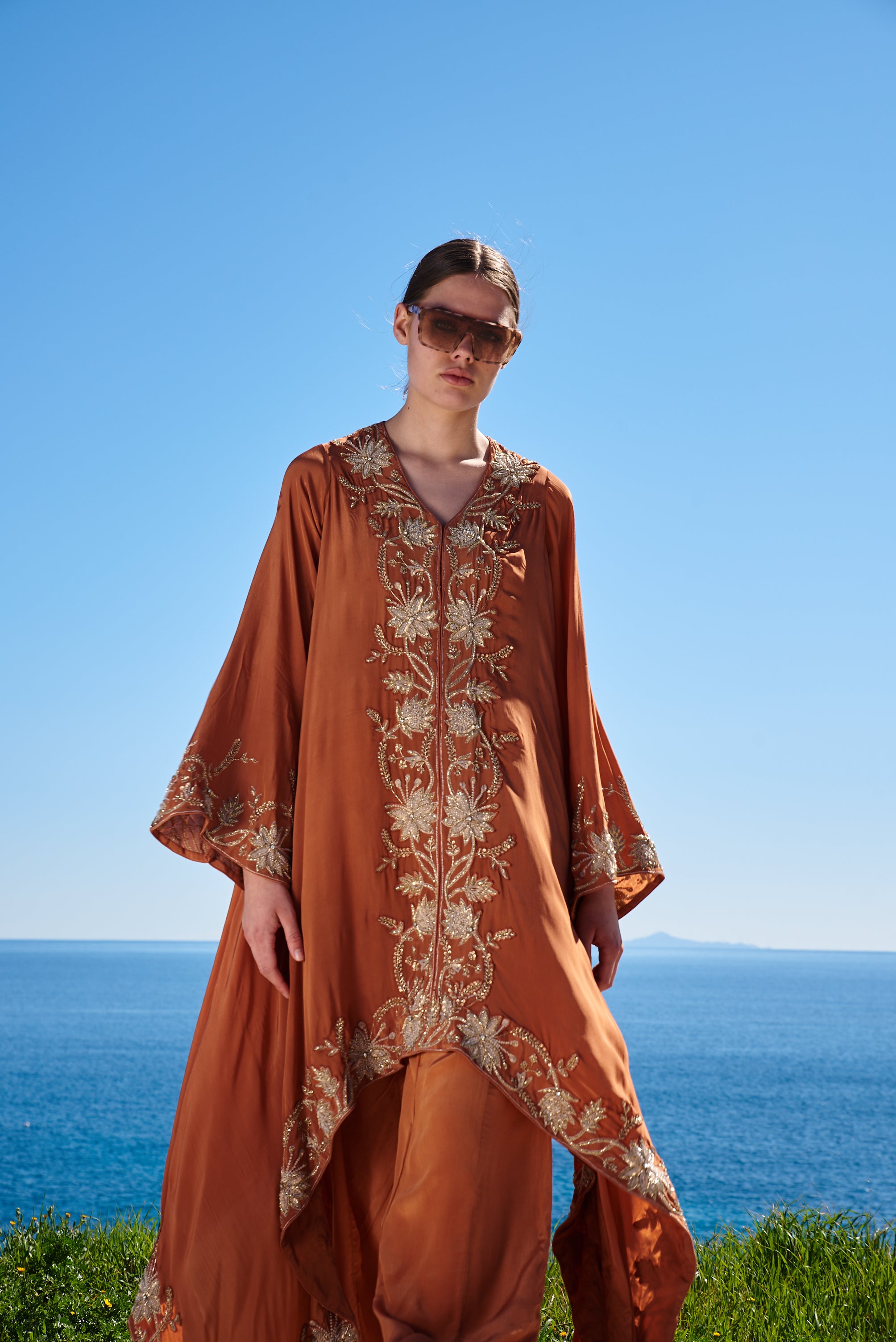 Rust crepe embroidered asymmetrical cape with rust crepe pants