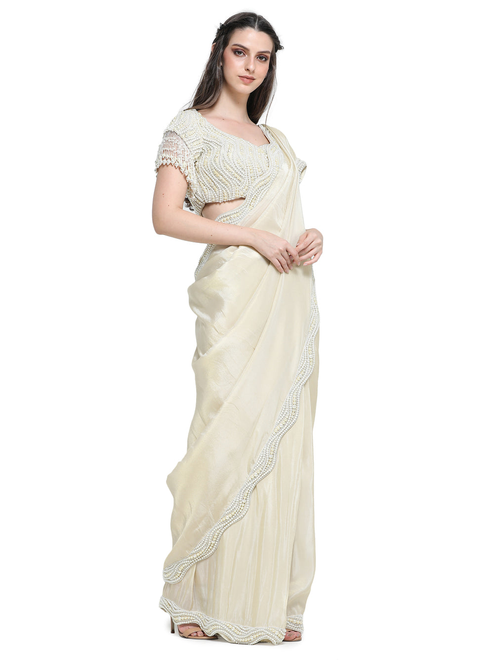Off white tissue organza sari with pearl work border and embroidered blouse