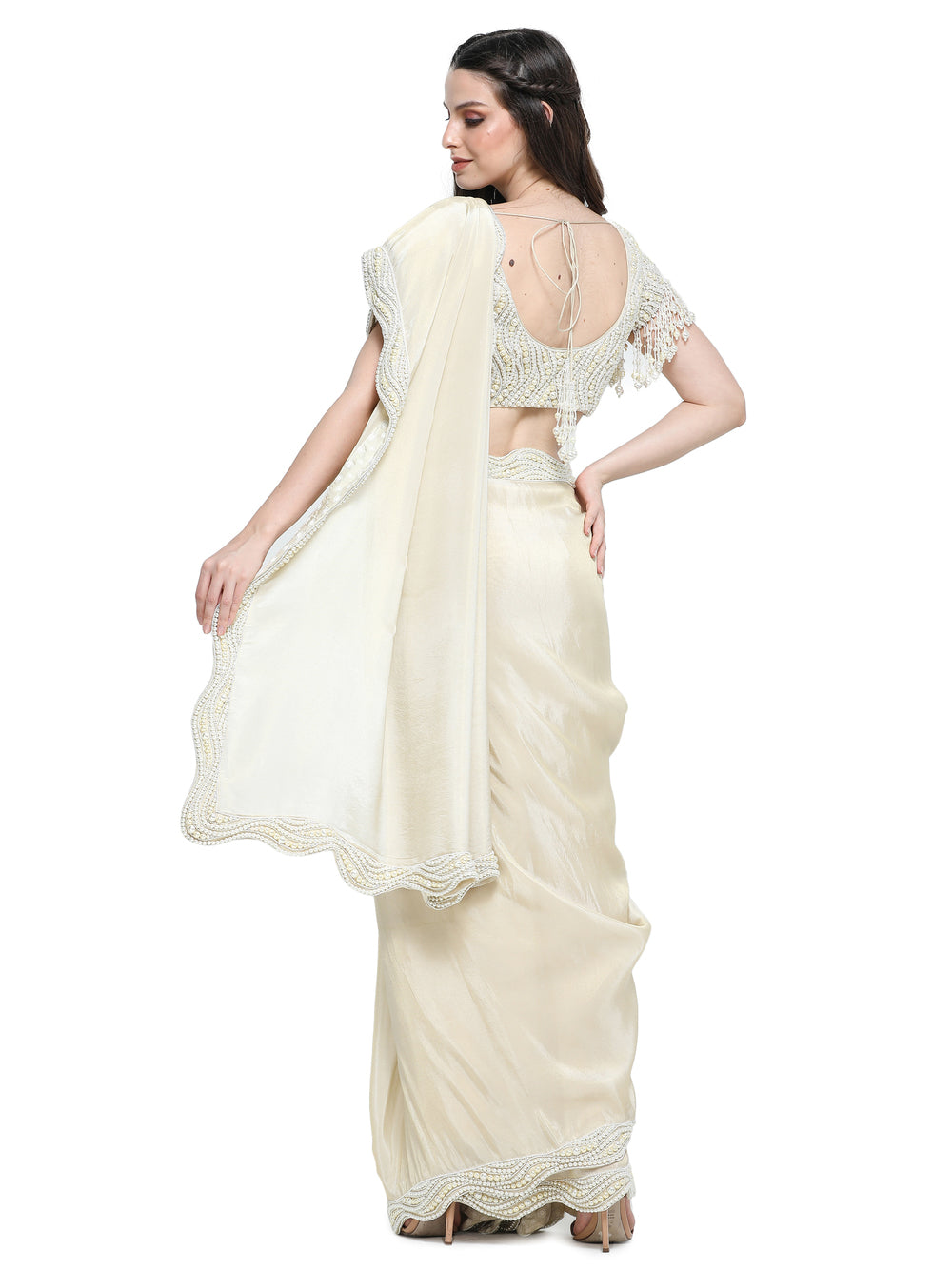 Off white tissue organza sari with pearl work border and embroidered blouse