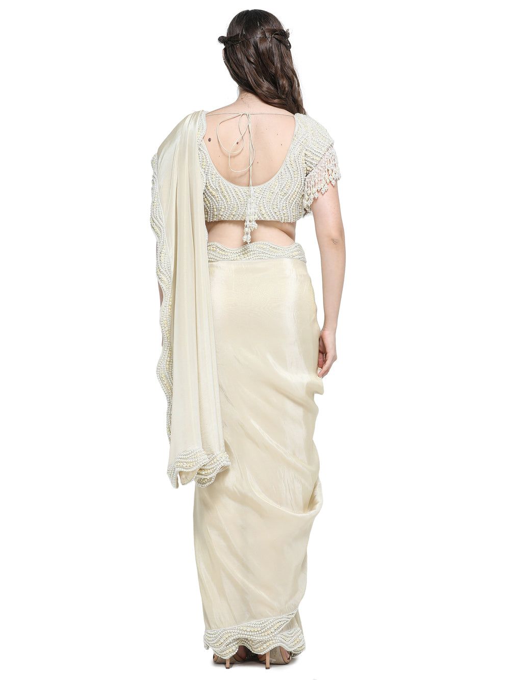 Off white tissue organza sari with pearl work border and embroidered blouse