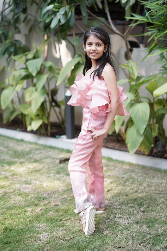 Pink ruffle top with embroidered pants