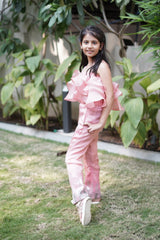Pink ruffle top with embroidered pants