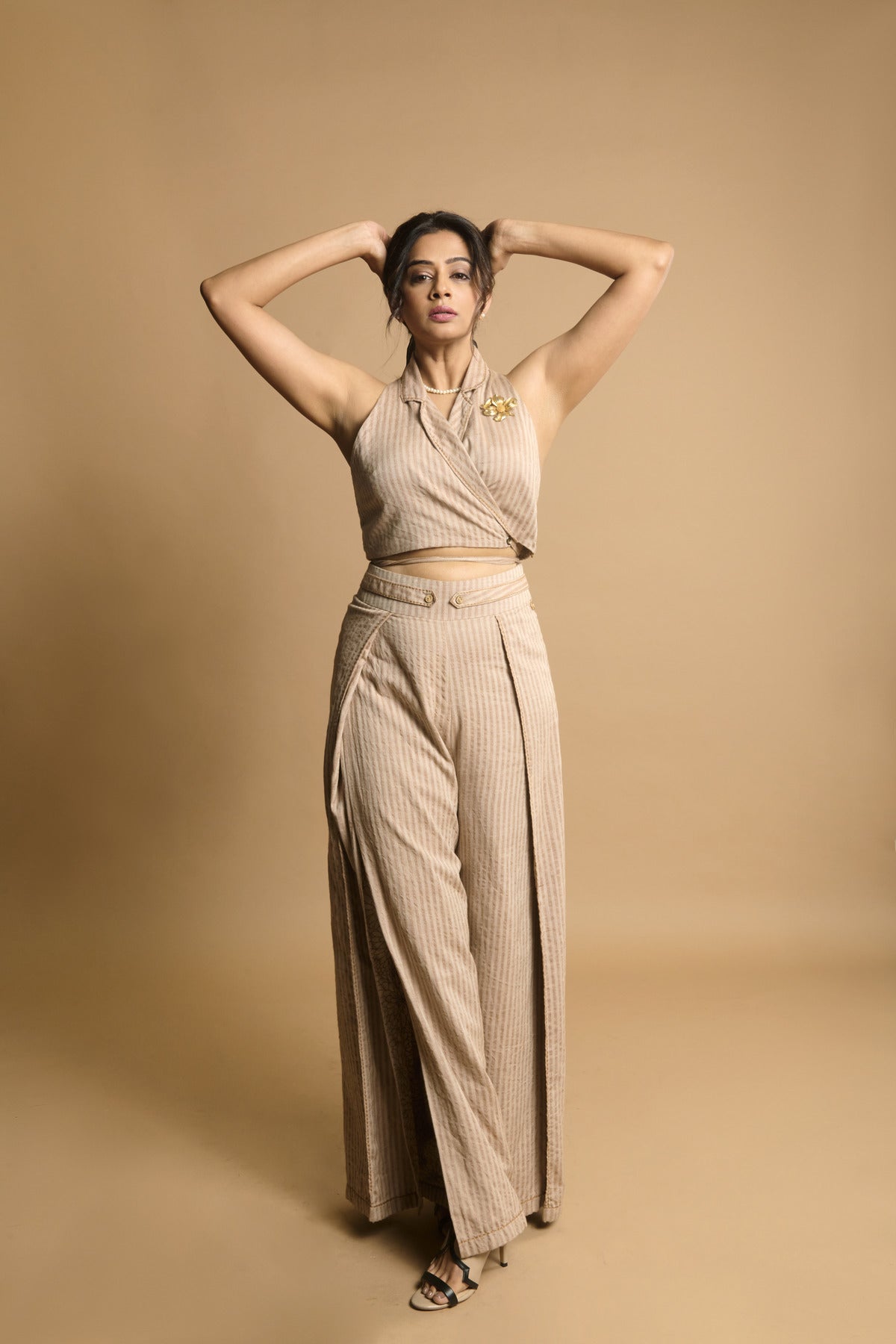Priya Mani in Beige stripe khadi oversized cord and bead embroidered blazer with a beige khadi waistcoat and overlapping slit pants with chawal taka details