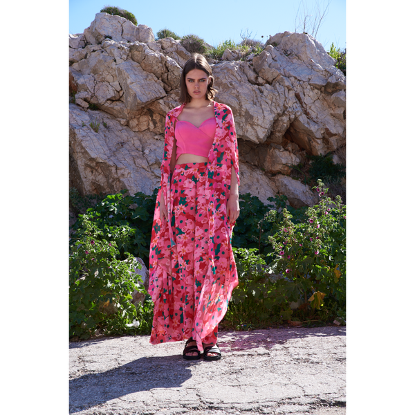 Bright floral printed throw and flared pants paired with pink bustier