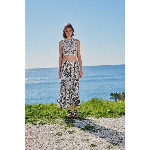 Black/white floral/leaf printed skirt paired with cord work embroidered crop top with lace back