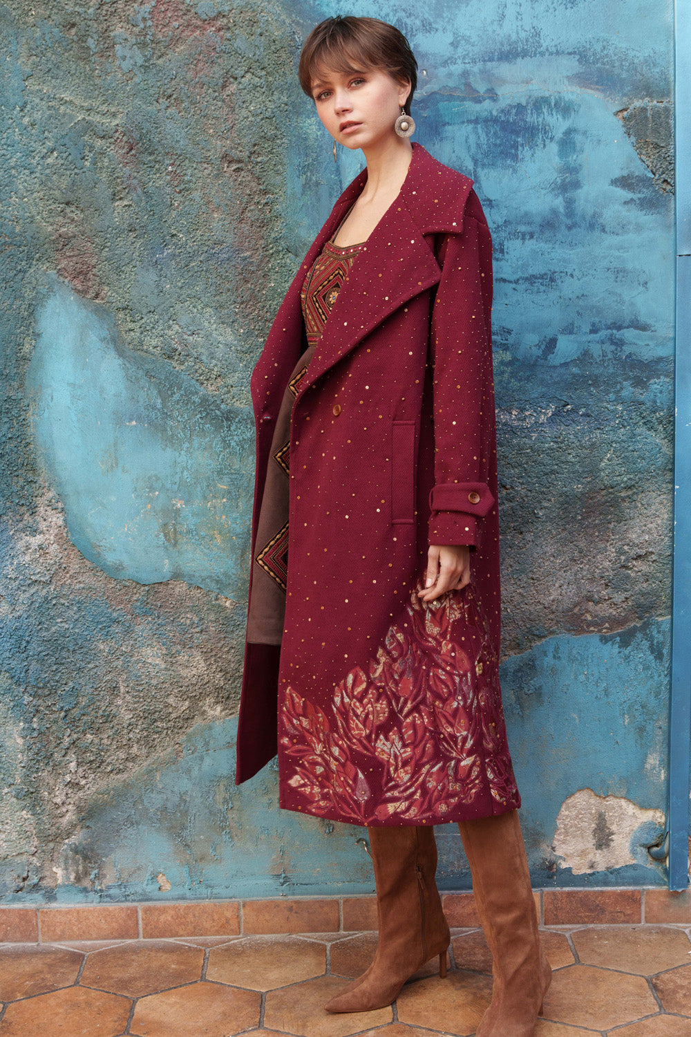 Red embroidered trench with printed appliqué.