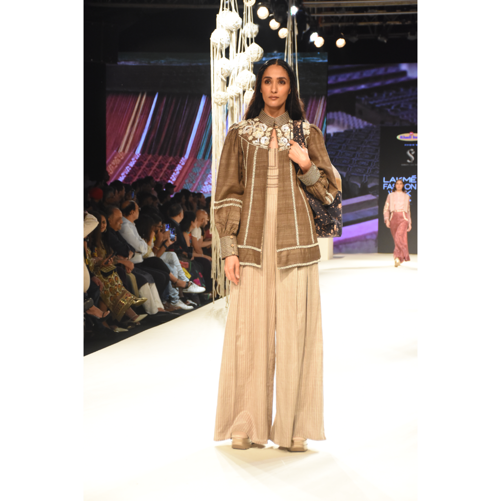 Brown khadi jacket with embroidered yoke and stripe jumpsuit with stitchline detais on bodice