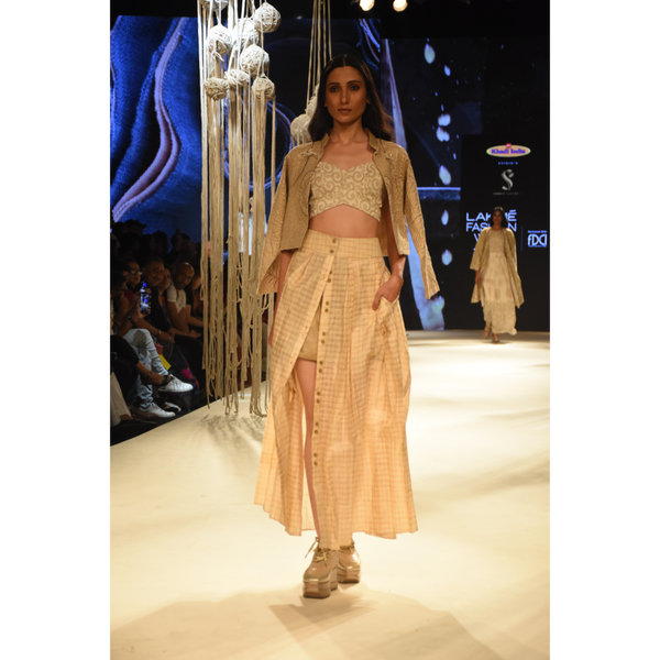 Beige embroidered crop jacket with bustier, beige shorts and front open 3 pleated skirt