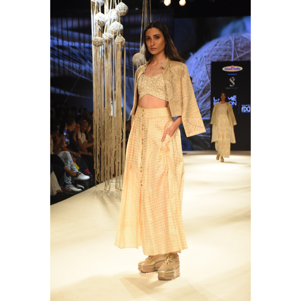 Beige embroidered crop jacket with bustier, beige shorts and front open 3 pleated skirt