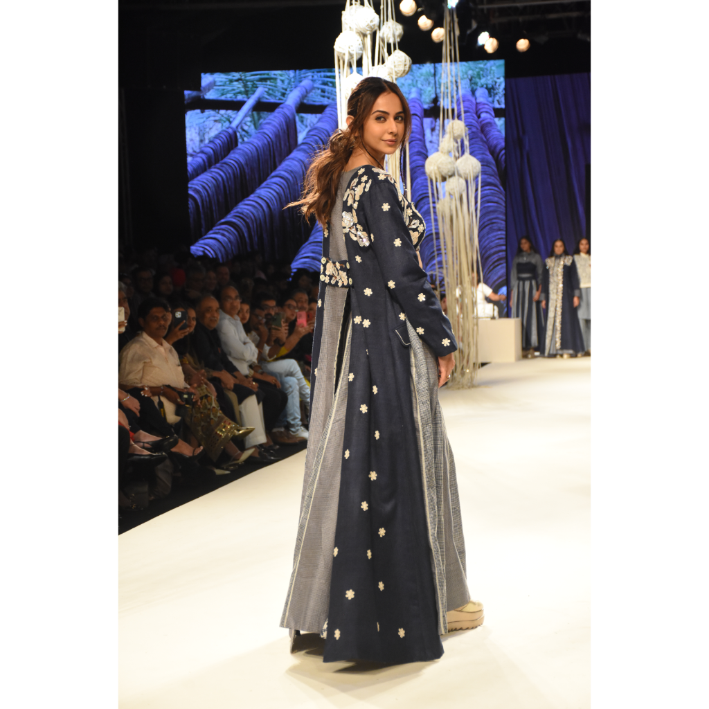 Blue embroidered long jacket with a front open checked kalidar skirt and an attached shorts with embroidered bustier