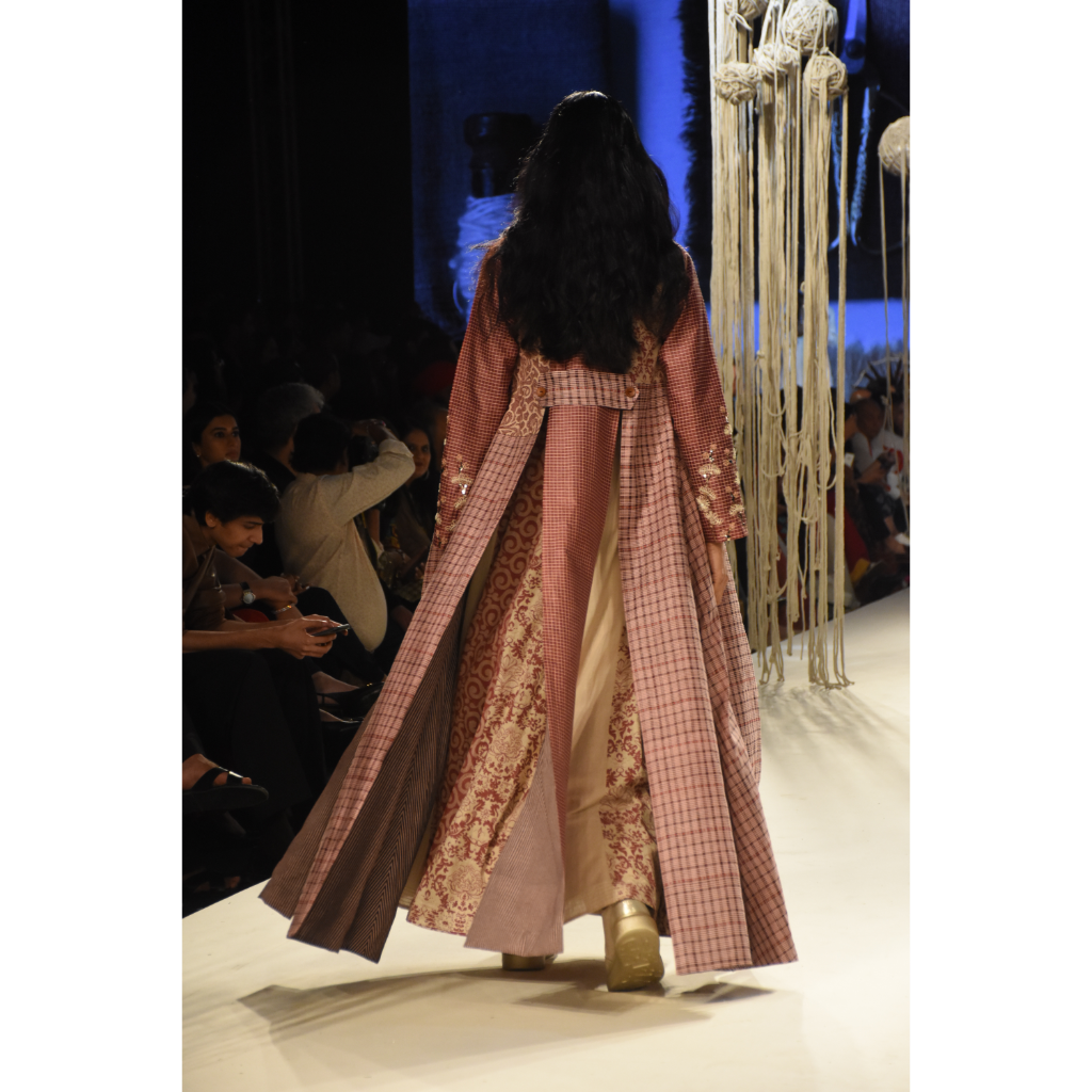 Red checked embroidered jacket with a beige crop top and color block printed kalidar skirt