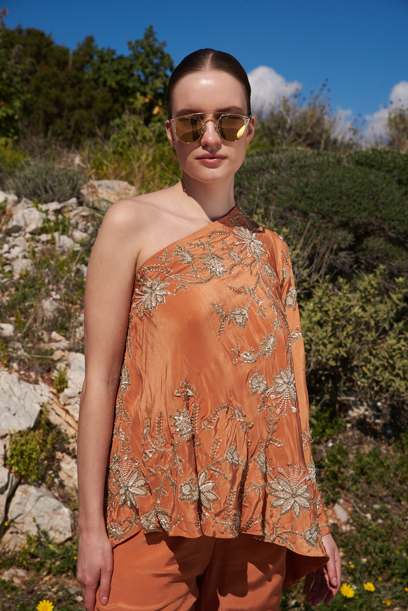 Rust crepe embroidered one off shoulder cape with rust crepe embroidered sharara pants
