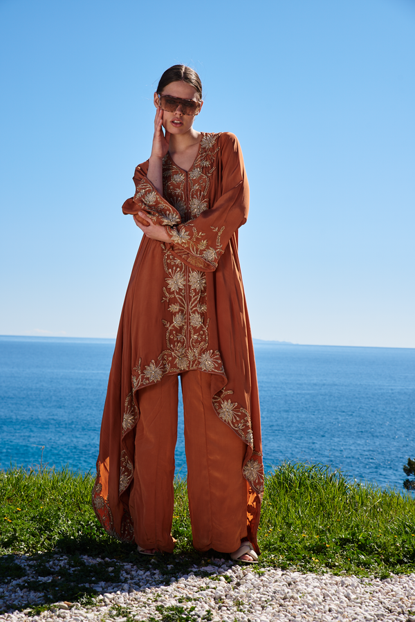 Rust crepe embroidered asymmetrical cape with rust crepe pants