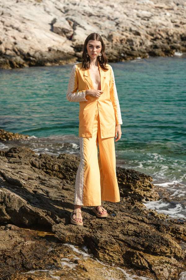 Yellow poplin pantsuit with eyelid lace details and bustier