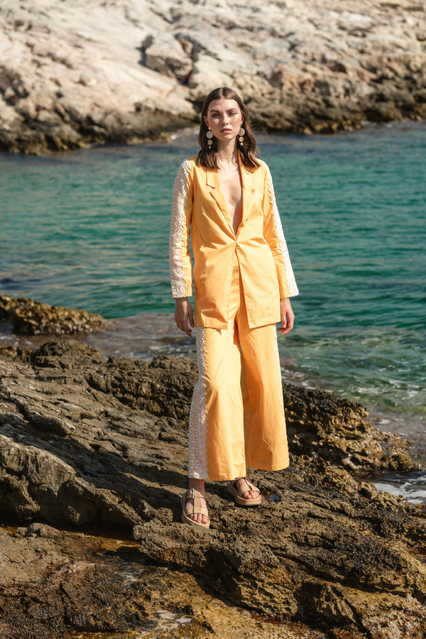 Yellow poplin pantsuit with eyelid lace details and bustier